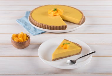 Cheesecake de mango, decorado con esta misma fruta. Cheesecake de mango.