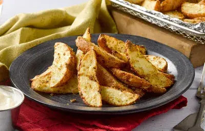 Receta de Papas rústicas con salsa de queso en Air Fryer